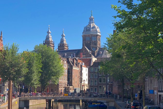 Absolutely Amsterdam - the Essential Introductory Walking Tour - Damrak and the roots behind the Red Light District