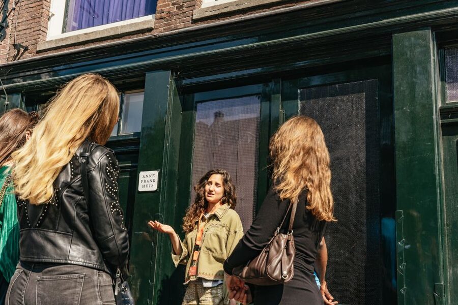 Amsterdam Anne Frank: Small-Group Walking Tour & Local Guide - National Monument and Royal Palace area: the story extends beyond one house