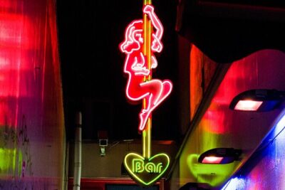 Amsterdam Red Light District Walking Tour in EN/DE/IT/ES - Amsterdam Centraal: legality, window systems, and what the city does
