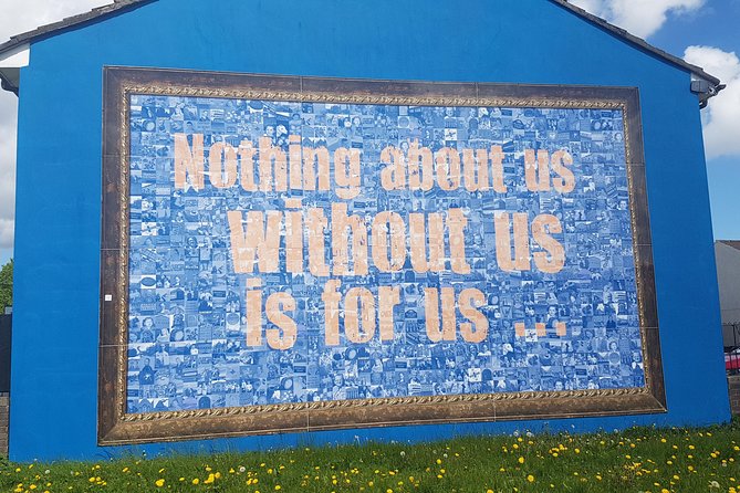 Belfast Troubles Murals Street Art and Peace Wall Walking Tour - Divis Street International Mural Wall: causes beyond Belfast
