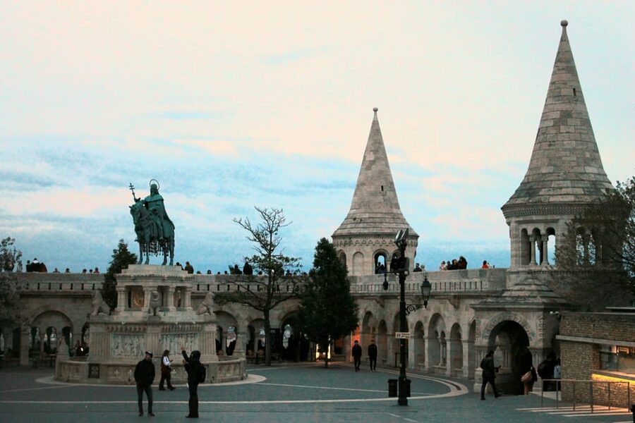 BloodThirsty Hungary: Walking tour & Dark Historical Stories - Castle District at night, with a performer in costume