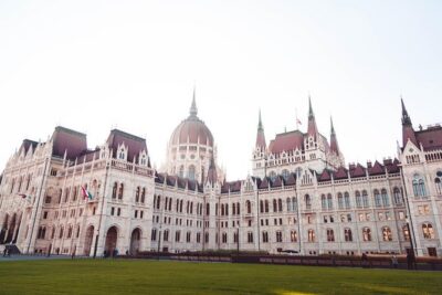 Budapest Historical Sightseeing - Free Walking Tour - Kálvin Square and Unger’s House: Calvin’s name, and a style-mix building
