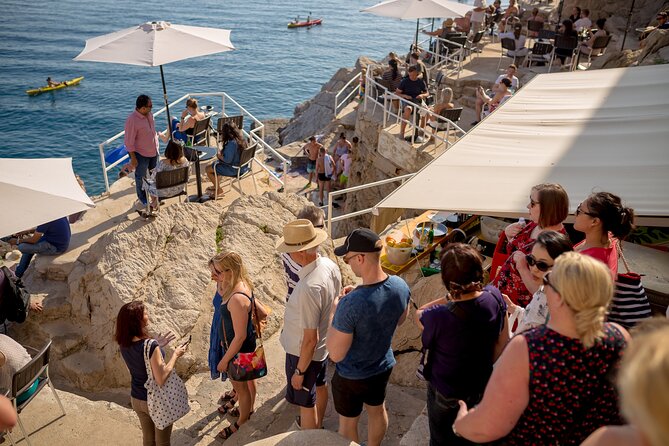 Dubrovnik Food and Drink Walking Tour with a Local Guide - Two churches and a bell tower: faiths in the same stone city