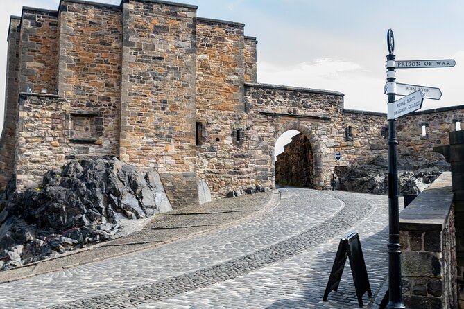 Edinburgh Castle: Guided Walking Tour with Entry Ticket - Esplanade stop: sieges, origins, and the Tattoo connection
