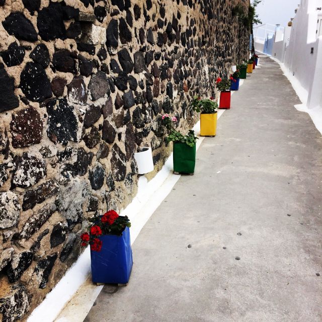 Fira: Guided Foodie Walking Tour with Tastings - Walking the caldera edge: volcano views, steps, and good shoes