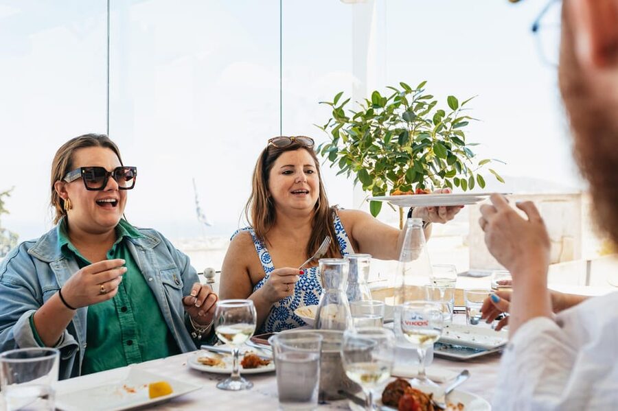 Fira: Guided Foodie Walking Tour with Tastings - Souvlaki, loukoumades, and Greek beverages you can order again later