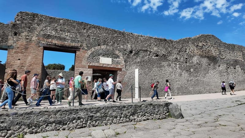 From Naples: Guided tour of Pompeii skip-the-line and round-trip train - The guided Pompeii walk: temples, frescoes, baths, and Roman routines