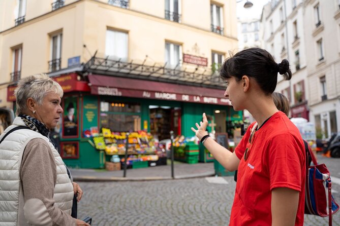 Hidden Montmartre: Paris' Secret Streets Walking Tour - Le Moulin de la Galette: windmills, wealth, and a secret passage to a view