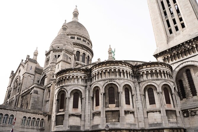 Hidden Montmartre: Paris' Secret Streets Walking Tour - Montmartre vineyards and Lapin Agile: where wine grapes meet artist legend