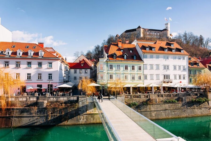 Ljubljana: 2h walking tour with local guide - Prešeren Square, Triple Bridge views, and castle backdrop energy
