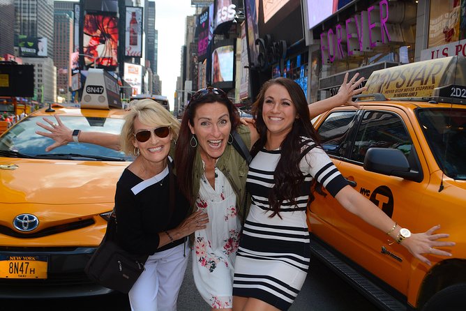 NYC Professional Photoshoot and Walking Tour with Private Guide - Start at 209 W 42nd St: Times Square sets the tone fast