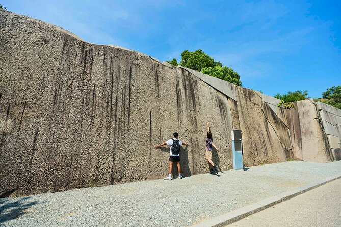 Osaka Castle Walking Tour and Castle Tower Admission - Osaka Castle Main Keep: Military Design, Armor, and the Largest Stone