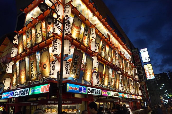 Osaka Local Foodie Walking Tour in Dotonbori and Shinsekai - Stop 1: Tsutenkaku and Jan-Jan Yokocho kushikatsu