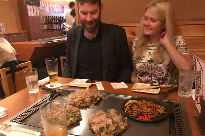 Osaka Local Foodie Walking Tour in Dotonbori and Shinsekai - Stop 5 and 6: the Glico sign photo moment, then Sennichimae Doguyasuji okonomiyaki