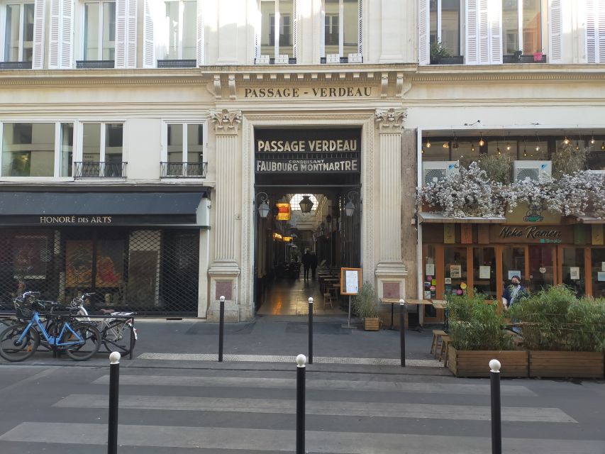 Paris: Covered Passages Walking Tour - Passage Choiseul: sunlit glass, long roof lines, and tiled-floor details