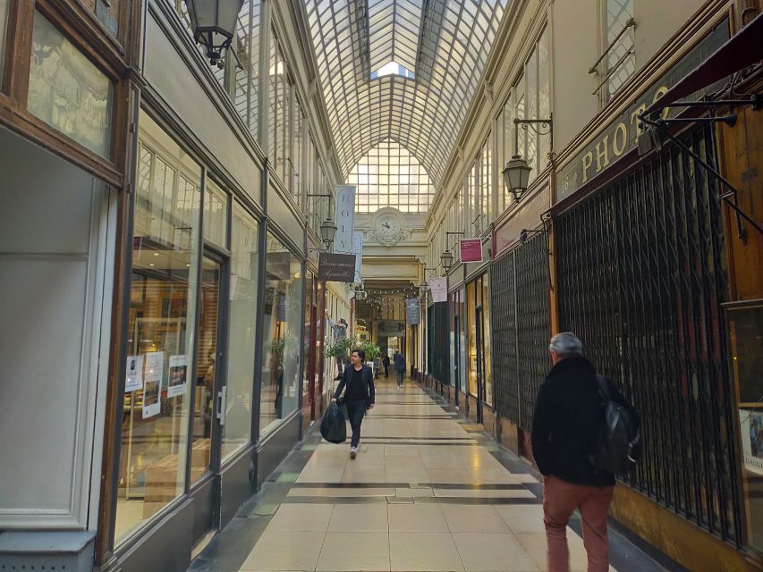 Paris: Covered Passages Walking Tour - Passage Jouffroy: narrower corridors, glass-and-iron detail, and a wax museum stop