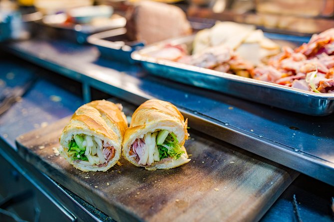 Private Street Food Evening Walking Tour in Ho Chi Minh City - Beyond the pancakes: beef, noodles, and a codfish specialty