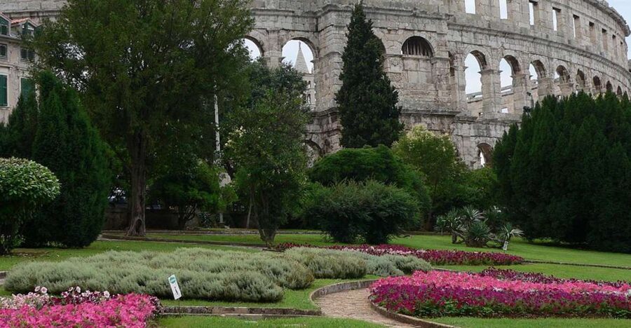 Pula: Historic Walking Tour with Local Guide & City Views - The Roman Amphitheatre: more than a gladiator photo stop