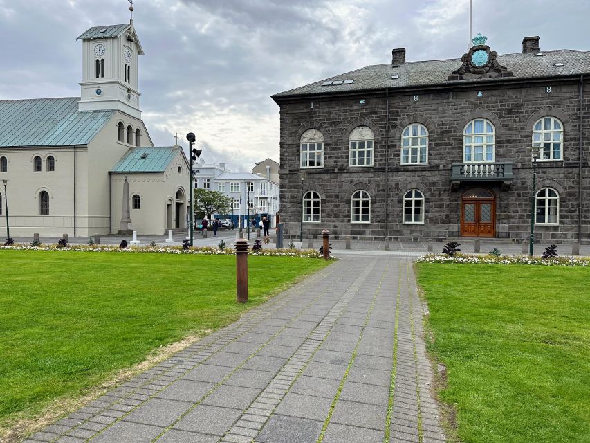 Reykjavik: City Walking tour in Small Group with Local Guide - Weather Reality in Reykjavík: Rain or Shine, With Built-In Shelter