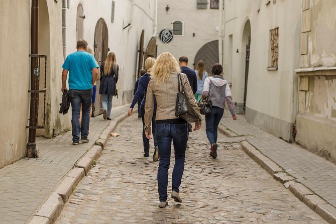Riga Old Town walking tour - Stop 4: Livu Square and the Blue Flowers Detail You’ll Remember