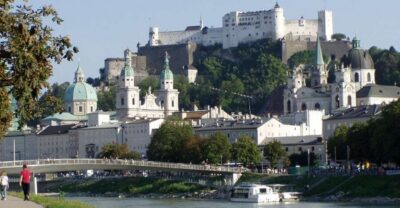Salzburg 2.5-Hour Walking Tour: Mozart, Old Town & More - Crossing Makartsteg toward Old Town: why the river moment matters