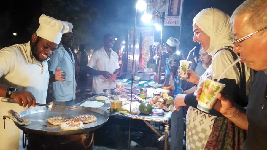 Stonetown: Food Markets and Street Food Walking Tour - Stone Town streets at night: UNESCO vibes without the museum feeling