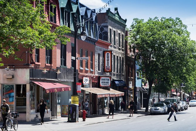 The Essential 101 Non-Touristy Walking Tour by Spade & Palacio - St-Laurent Boulevard: Festival Street Art, Thrift Stops, and Immigration Stories