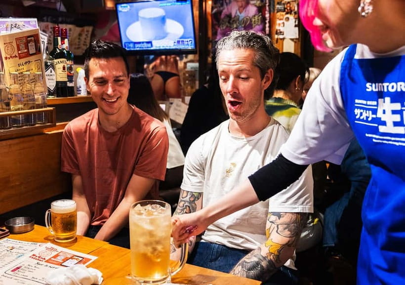 Tokyo: Shinjuku Bar Hopping & Night Walking Tour - Omoide Yokocho: red-lantern izakaya energy and reservation help