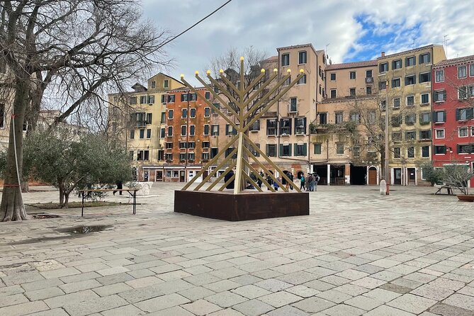 Venice: Jewish Ghetto Walking Tour with Synagogues Visit - Campo del Ghetto Nuovo square: the bas-reliefs most people miss