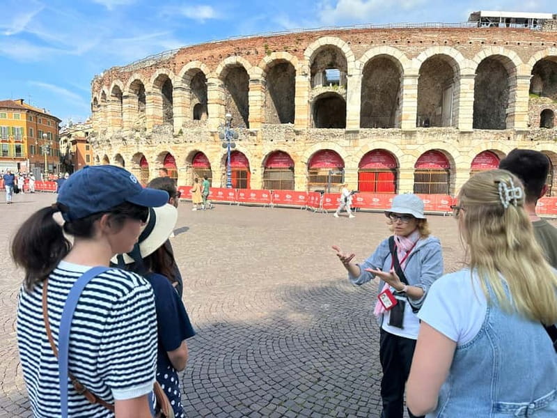 Verona: Guided Small Group Walking Tour of the City of Love - Piazza dei Signori (Dante’s Square) and the statue moment